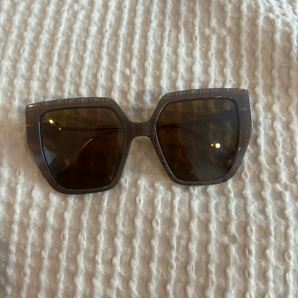 FENDI Brown Sunglasses with gold arms.